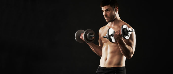 muscly man lifting weights
